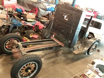 1926 Model TT truck, rear view, cab and flatbed frame in the workshop